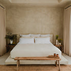 Minimalist bedroom scene with Waves Quilt crafted from organic cotton luxury bedding by Rest & Reset