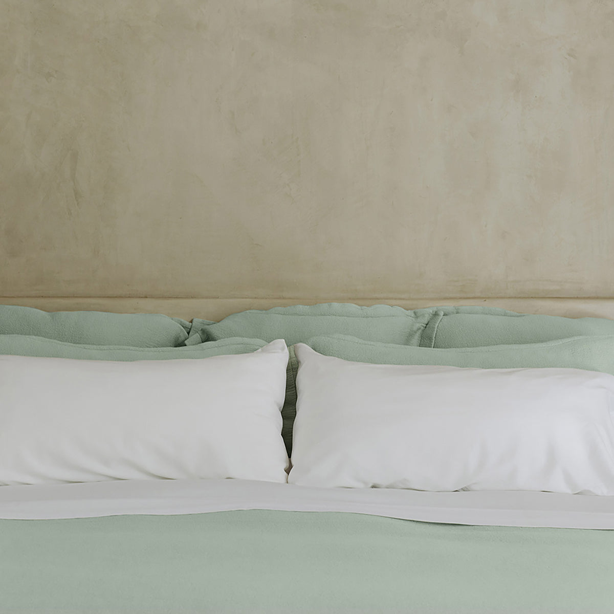 Waves Euro Sham by Rest & Reset placed on a made bed, designed for everyday comfort and visual texture