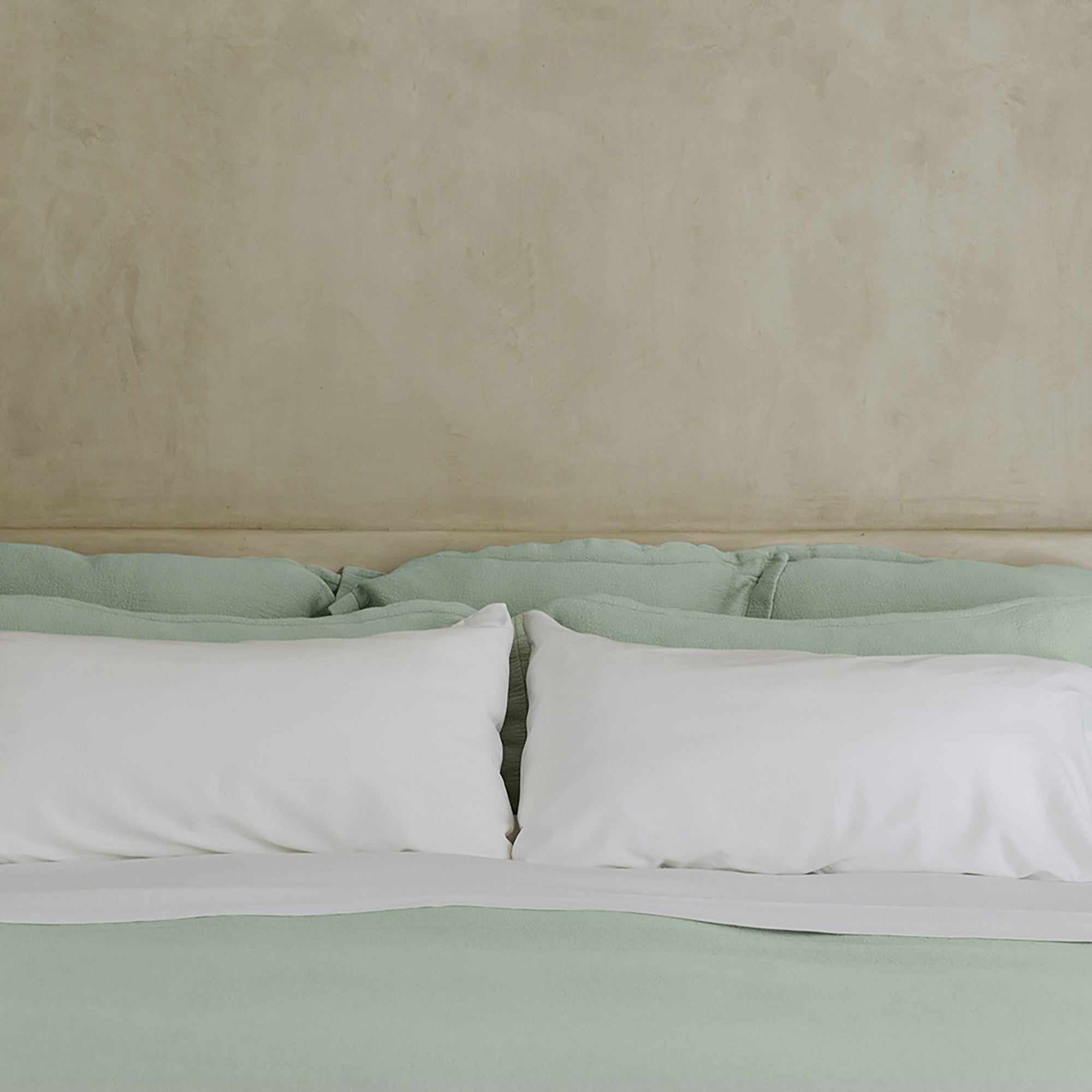 Waves Euro Sham by Rest & Reset placed on a made bed, designed for everyday comfort and visual texture