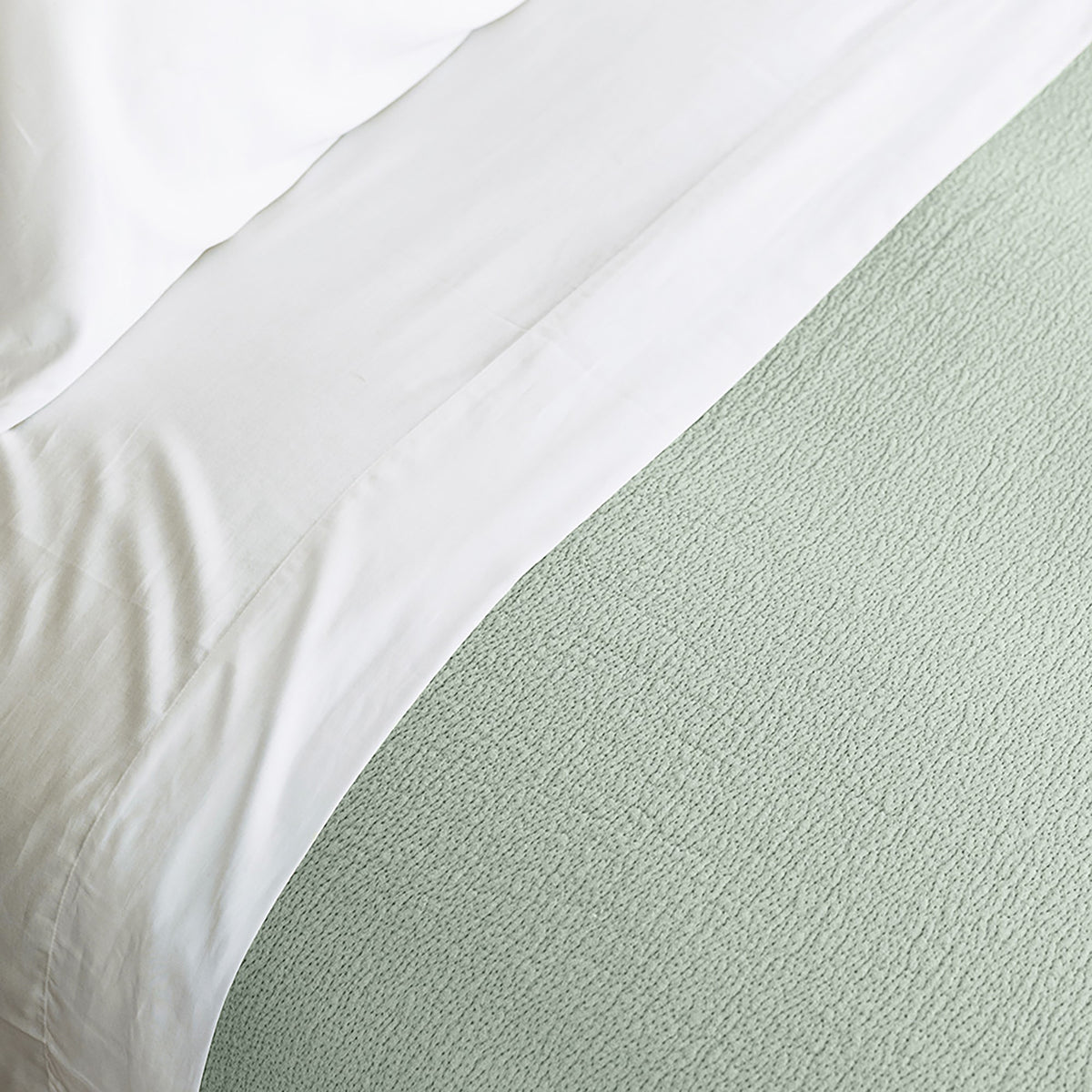 Soft-textured Waves Quilt in organic cotton shown in neutral luxury bedroom by Rest & Reset