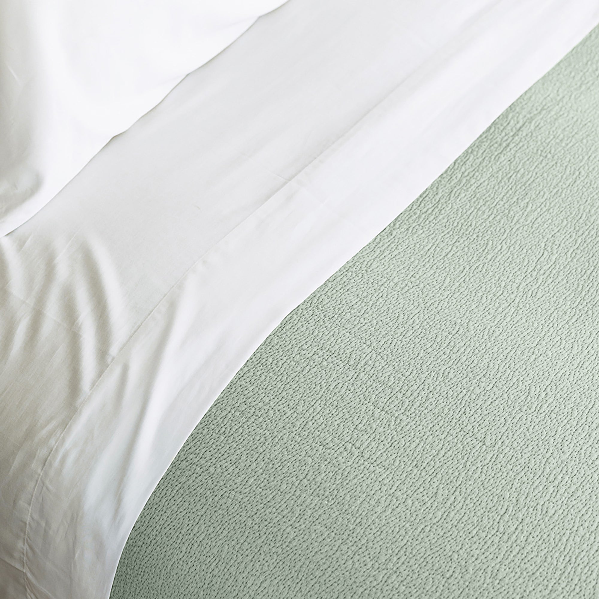 Soft-textured Waves Quilt in organic cotton shown in neutral luxury bedroom by Rest &amp; Reset