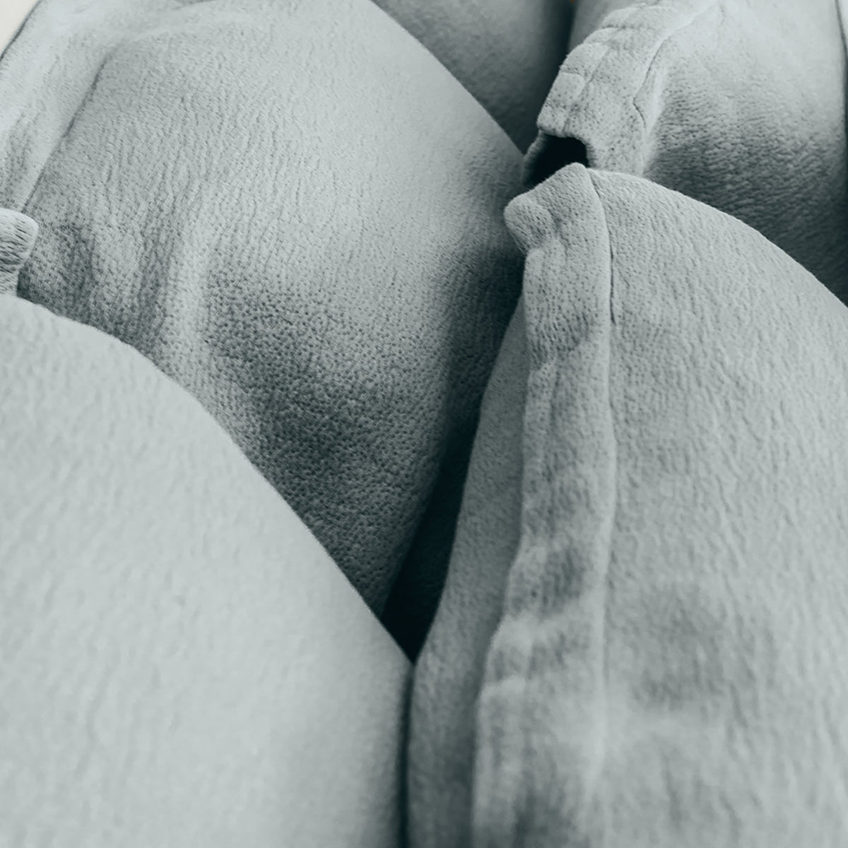 Close-up of organic cotton fabric on Waves Pillow Sham by Rest & Reset, highlighting soft texture and dimensional weave