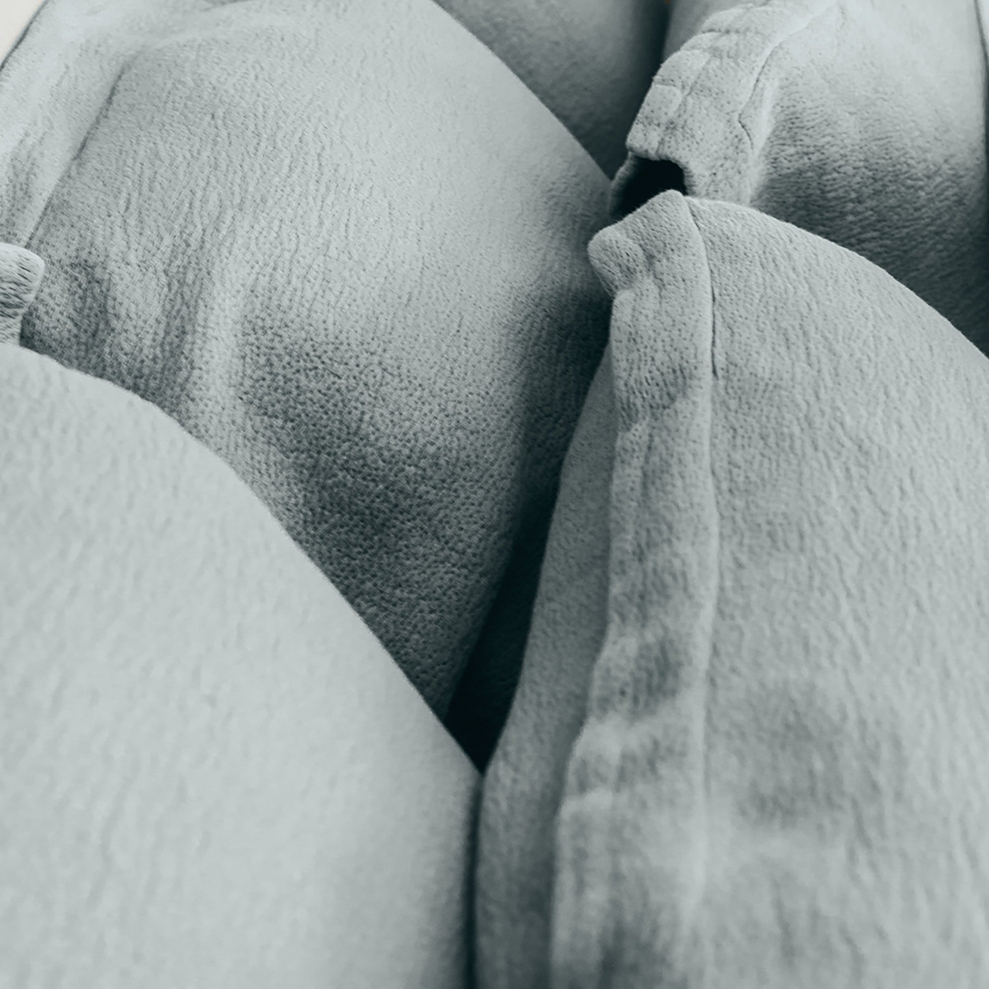 Close-up of organic cotton fabric on Waves Pillow Sham by Rest & Reset, highlighting soft texture and dimensional weave