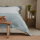 Close-up of Waves Quilt showing wave stitching detail in organic cotton luxury bedding by Rest & Reset