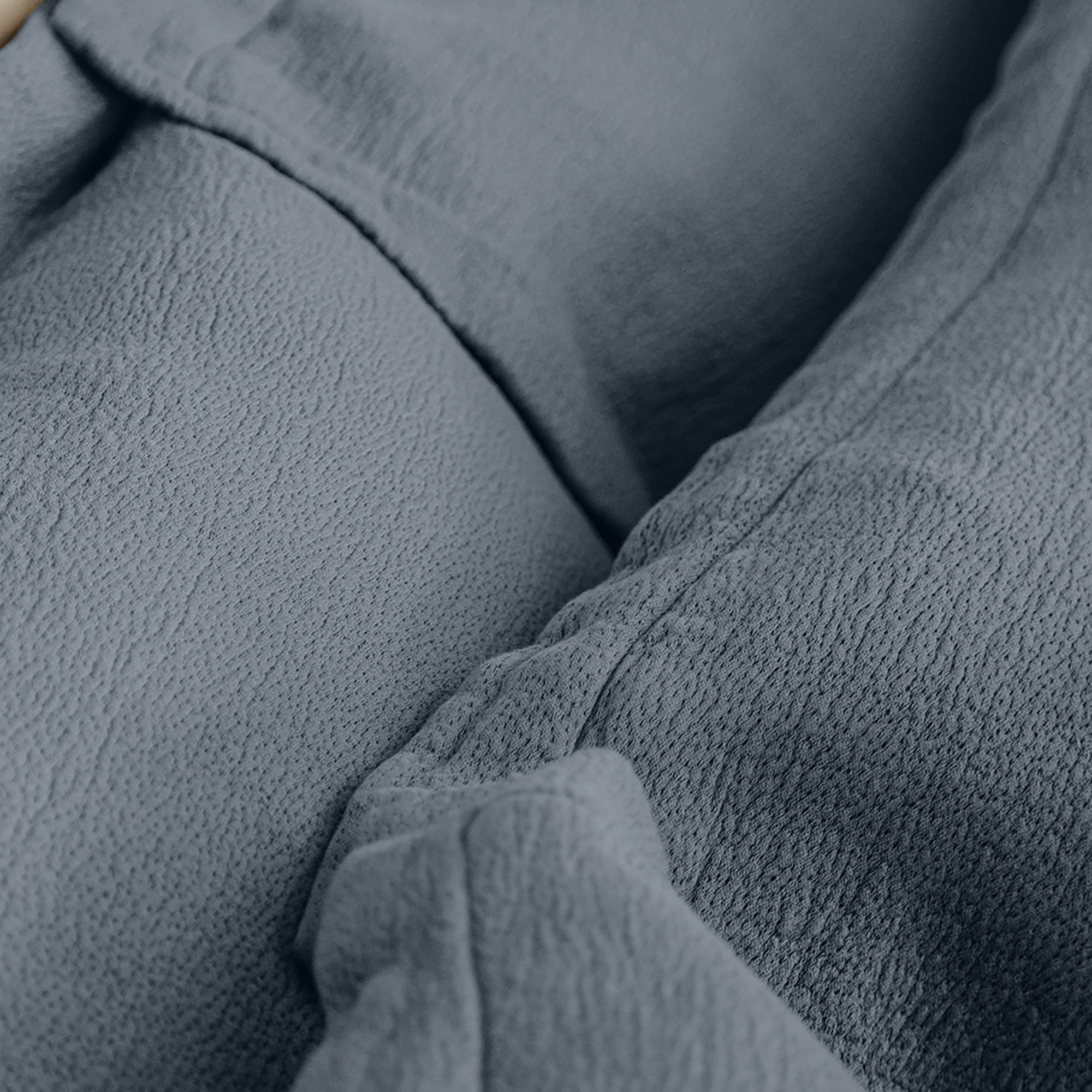 Close-up of the quilted pattern on Waves Euro Sham by Rest & Reset, showcasing craftsmanship and tactile texture