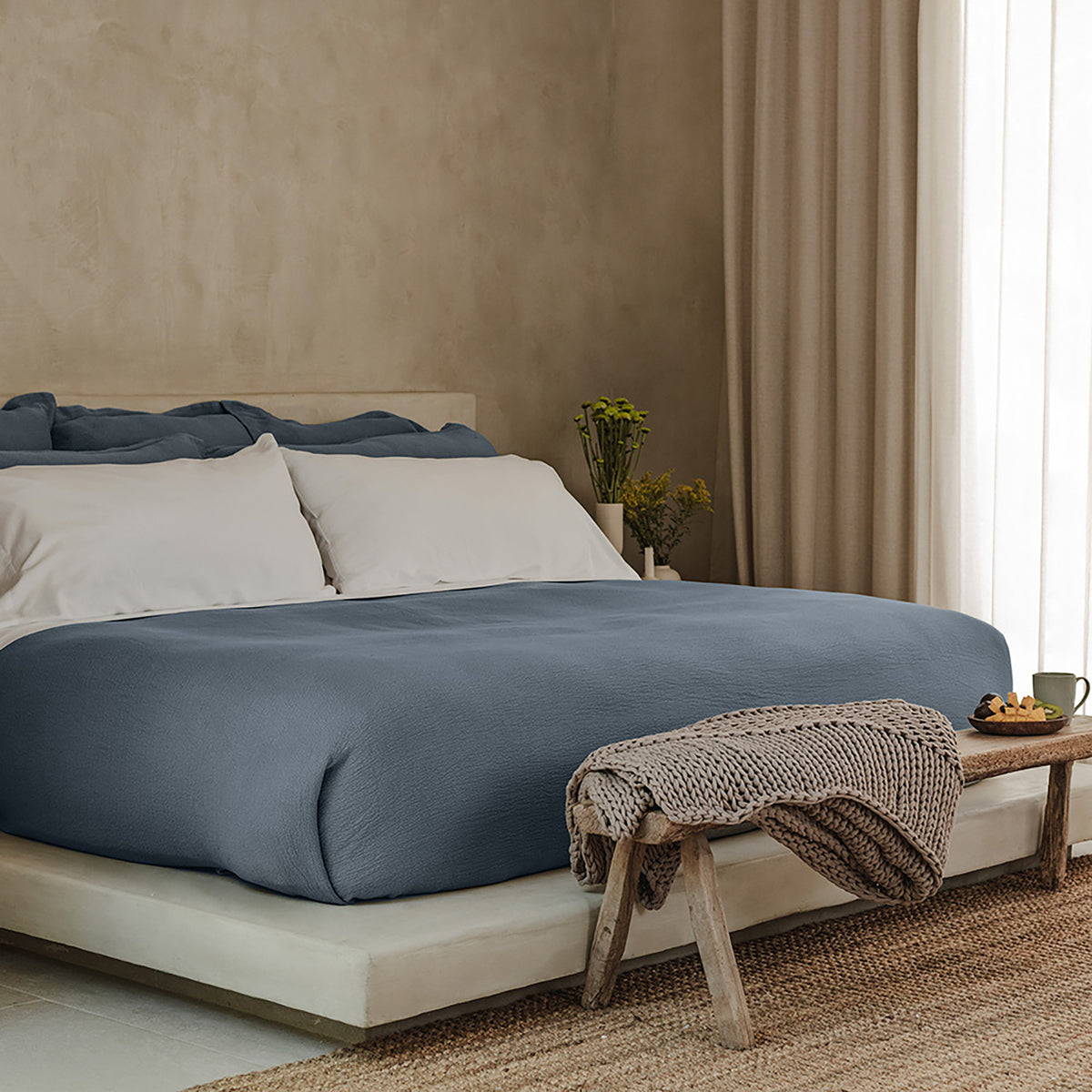 Waves Euro Sham by Rest & Reset layered with coordinating bedding, designed for softness and depth