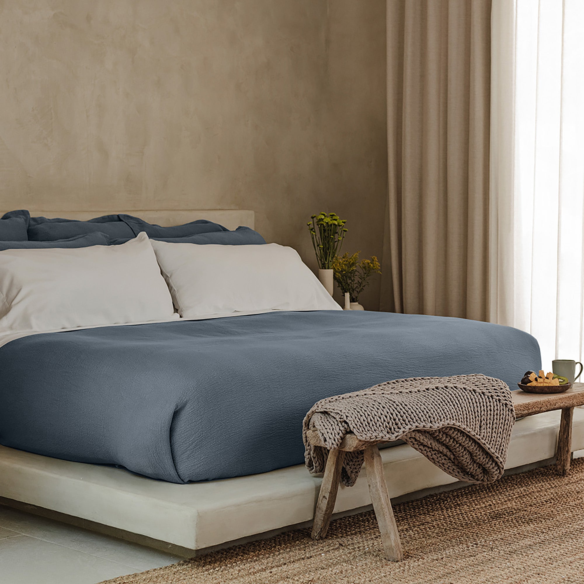 Waves Euro Sham by Rest & Reset layered with coordinating bedding, designed for softness and depth