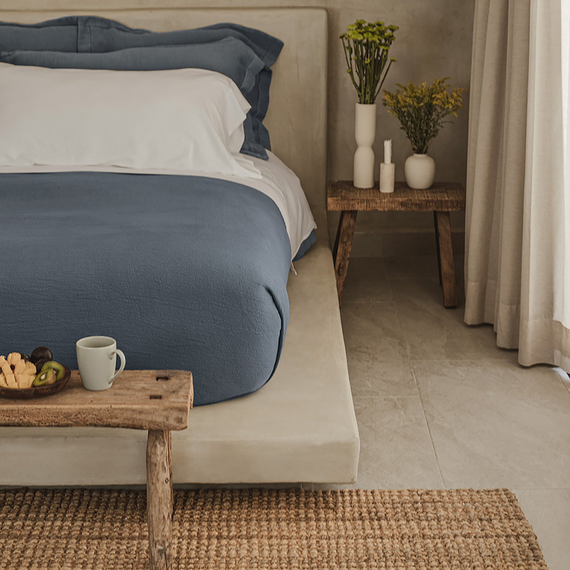 Waves Pillow Sham by Rest & Reset styled on a made bed from the front, designed for everyday layered comfort