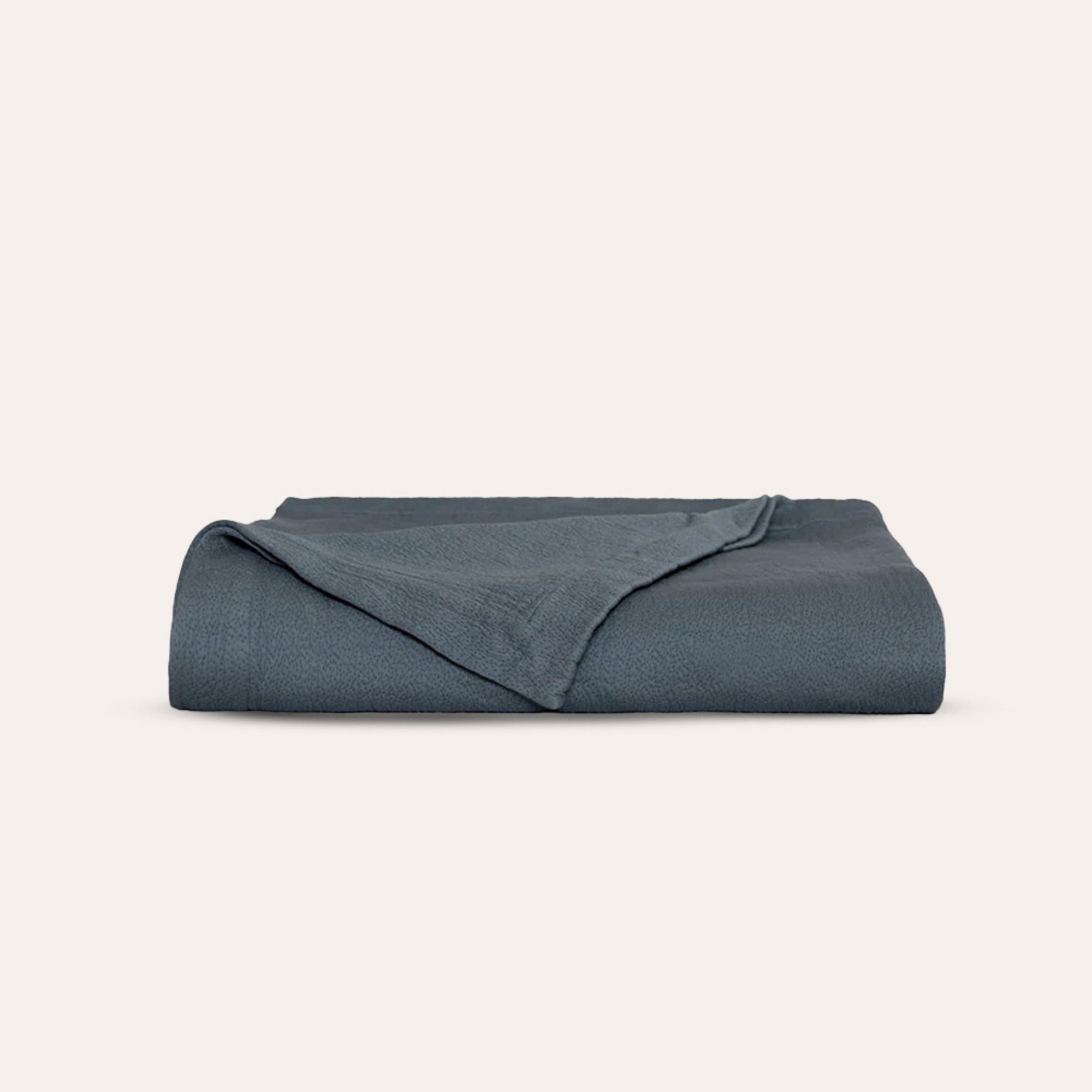 Waves Quilt laid flat to showcase organic cotton fabric and elegant quilting by Rest &amp; Reset