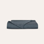 Waves Quilt laid flat to showcase organic cotton fabric and elegant quilting by Rest & Reset