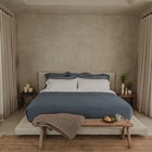 Bedroom styling with Waves Quilt highlighting organic cotton luxury bedding comfort by Rest & Reset