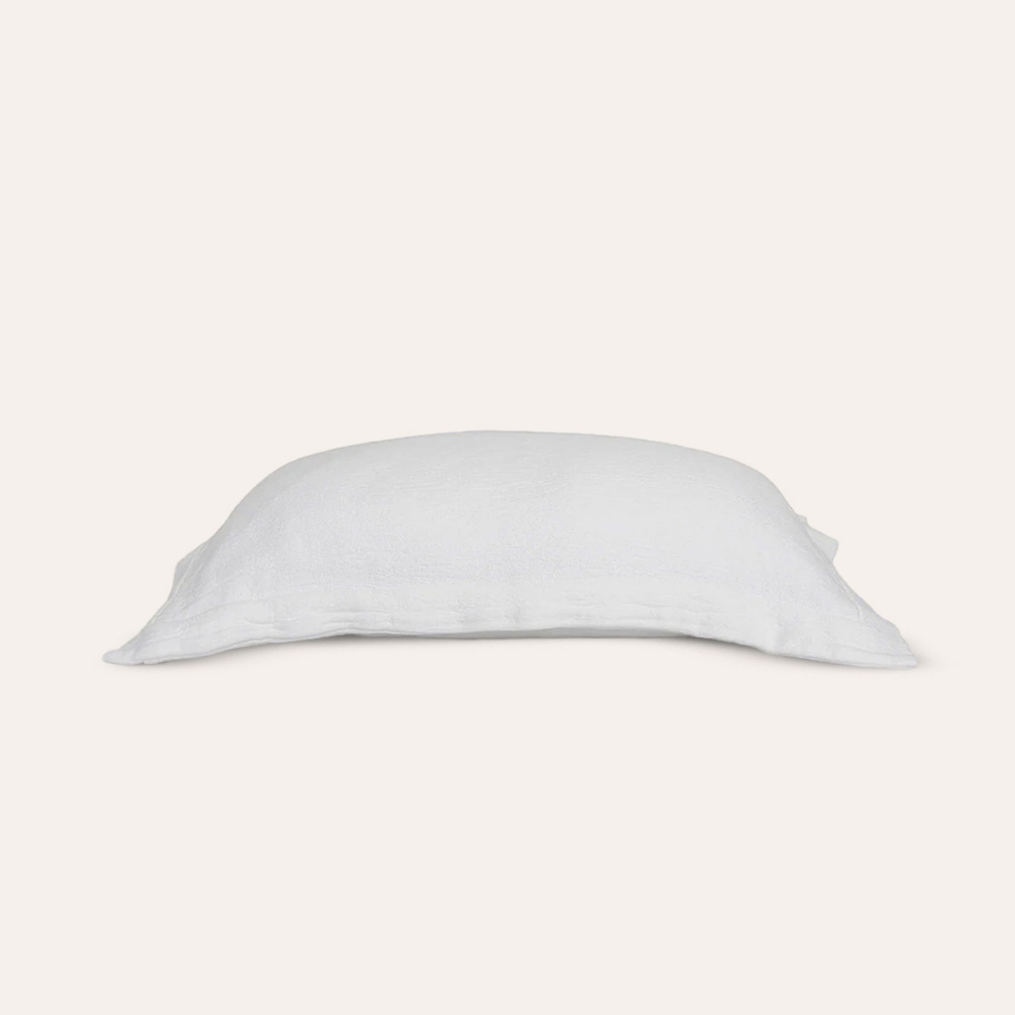Waves Euro Sham by Rest & Reset folded in a lighter shade, highlighting breathable organic cotton fabric