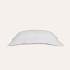 Waves Pillow Sham by Rest & Reset folded in a lighter shade, showcasing softness and refined finishing