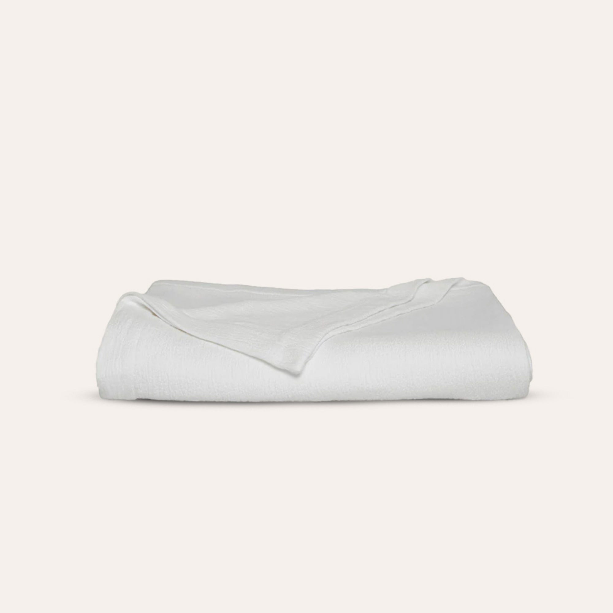 Waves Quilt styled with pillows in refined organic cotton luxury bedding by Rest &amp; Reset