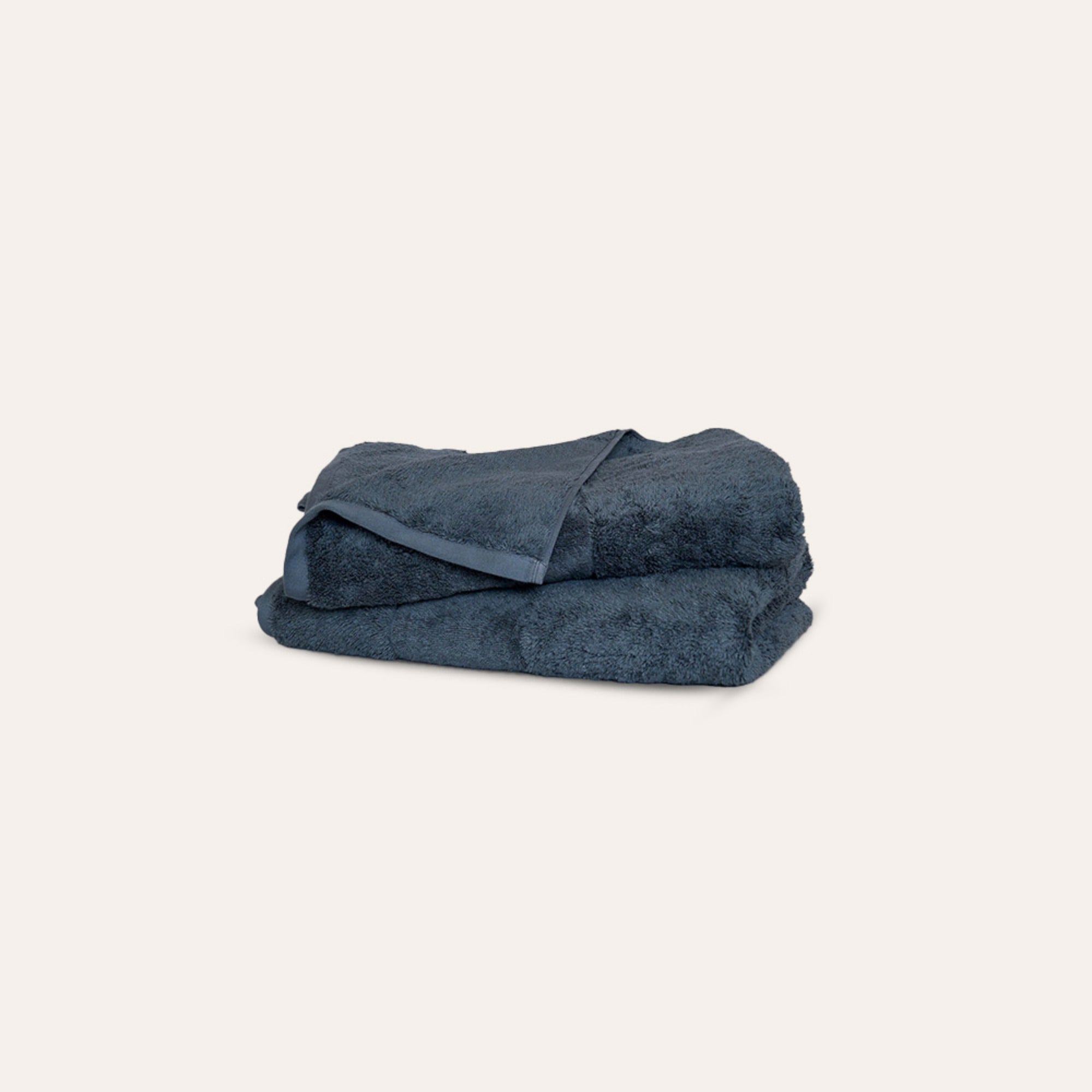 Ritual Washcloths Pair by Rest & Reset folded in a darker shade, highlighting plush organic cotton fabric