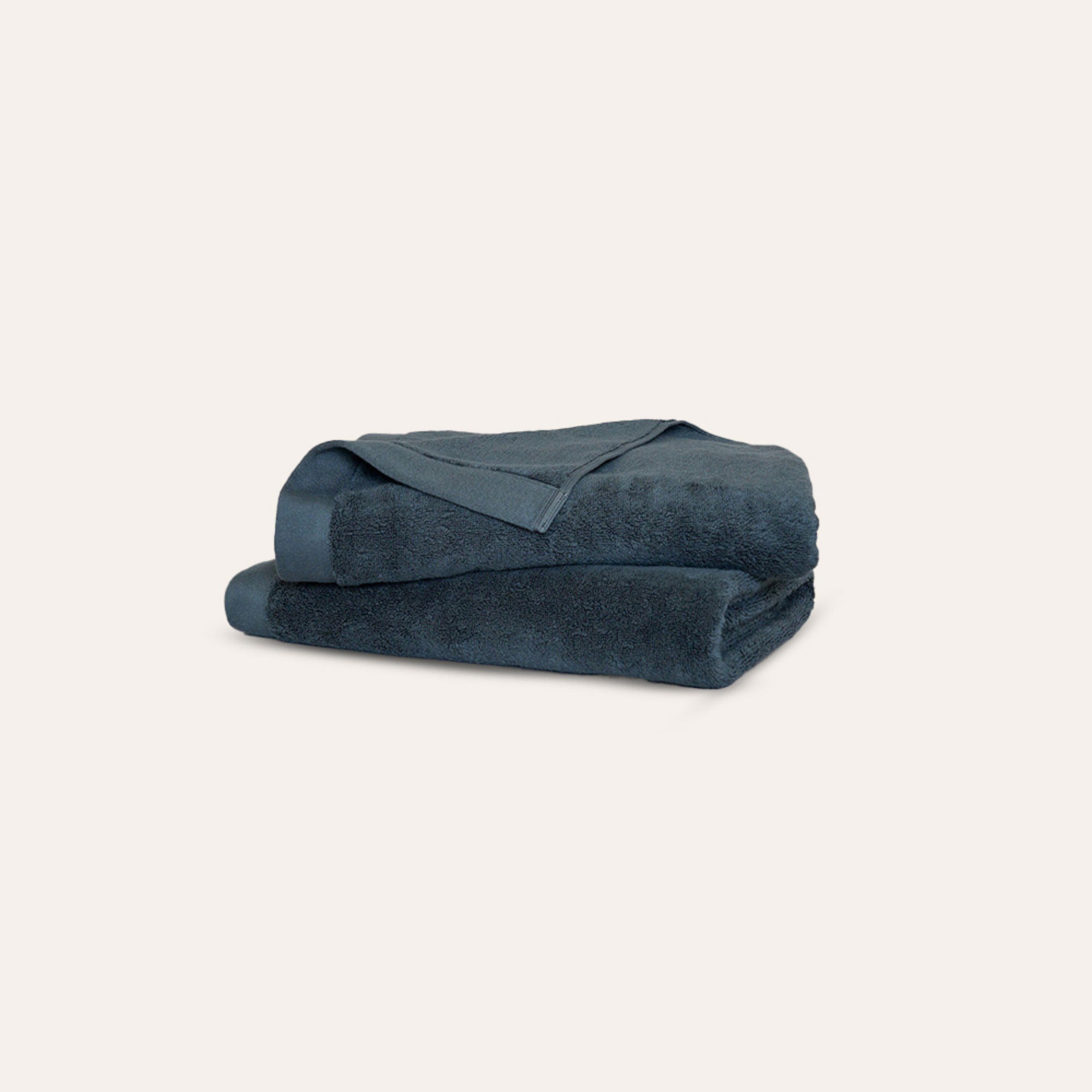 Oasis Washcloths Pair by Rest & Reset folded in a darker shade, highlighting plush organic cotton texture