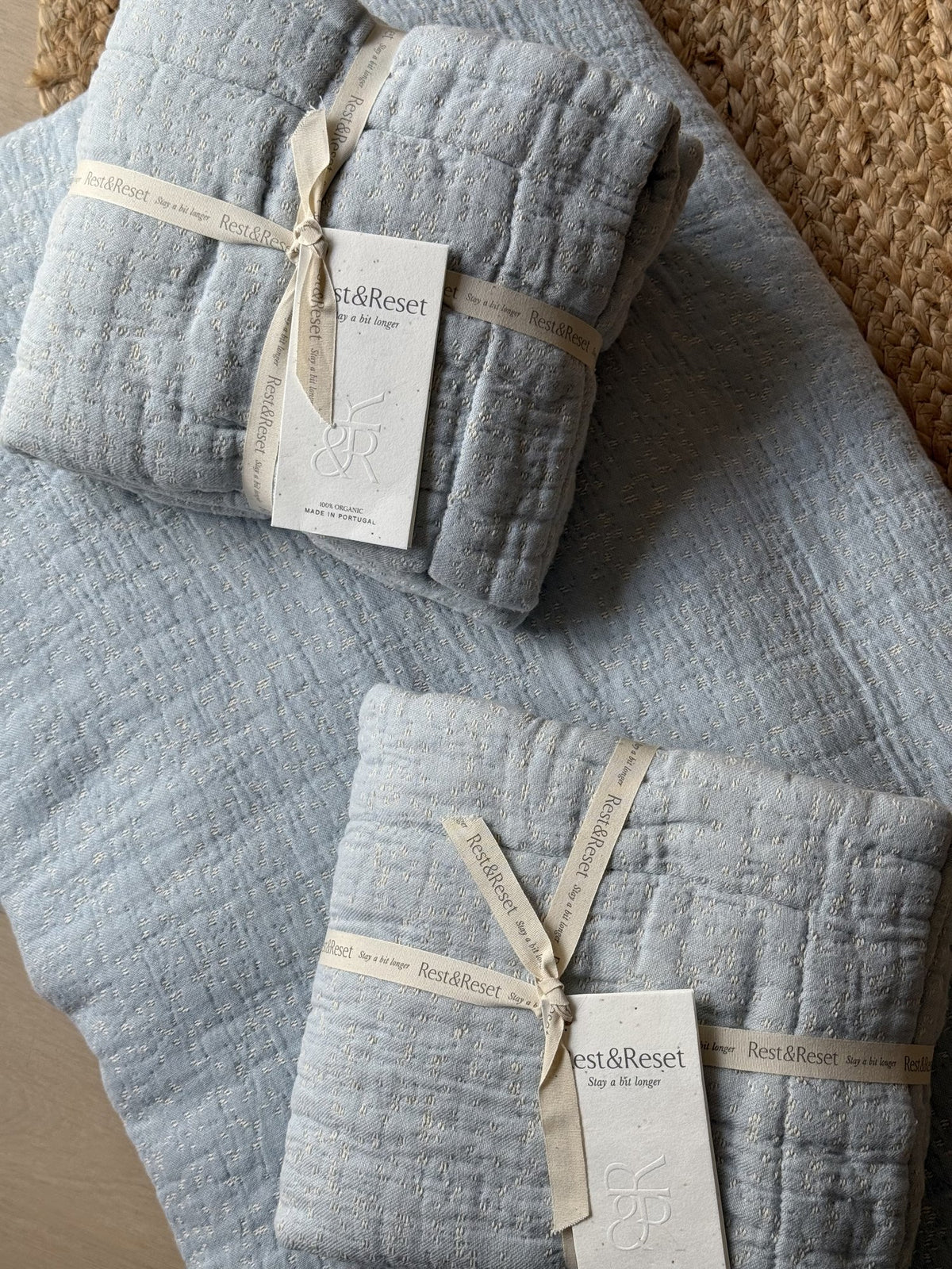 Rest & Reset bedding tied with signature ribbon inside the gift box